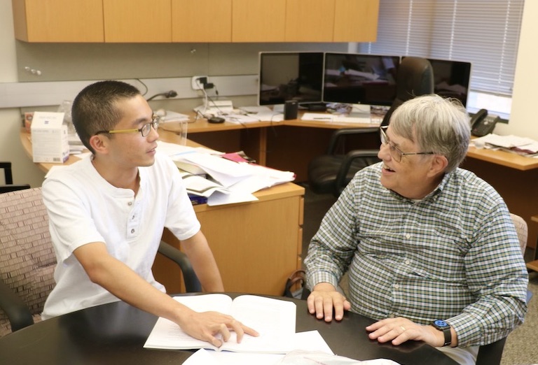 Jim Chelikowsky and recent Oden Institute PhD graduate, Kai-Hsin Liou, sitting in the Professor's Oden Institute office.